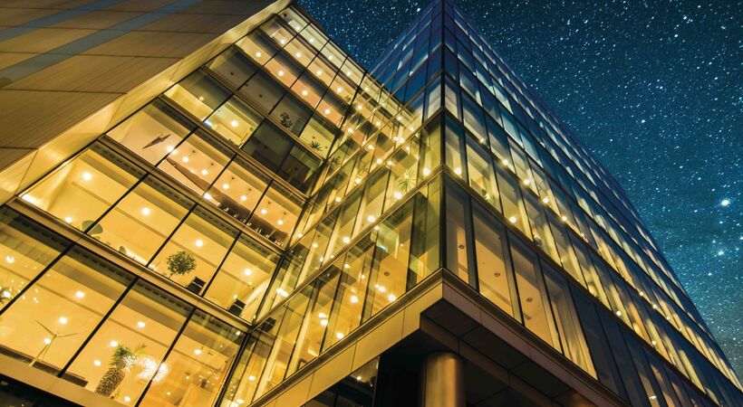 Modern office building exterior at night