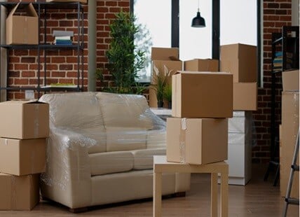 Living room with moving boxes during residential move