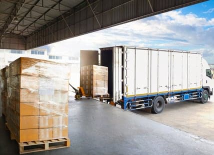 Truck backed into warehouse loading dock