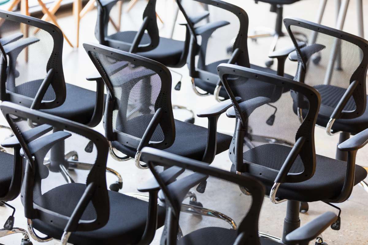 Close-up of office chairs around a conference table