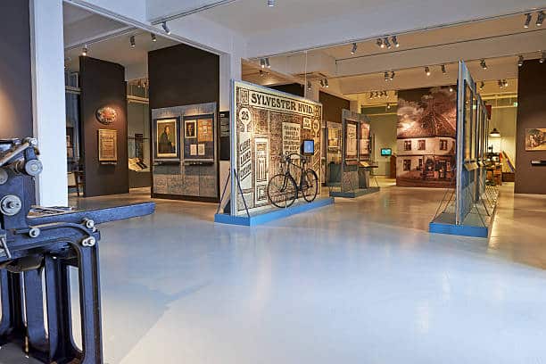 Modern retail storefront interior with shoppers