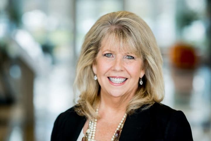 Professional headshot of Renee Hofer in business attire indoors