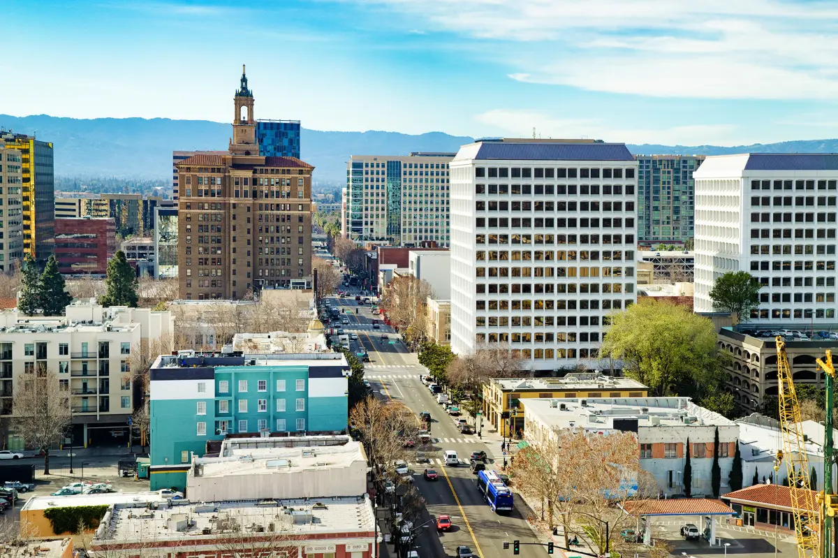 San Jose streets lined with mid-rise office buildings under a clear blue sky
